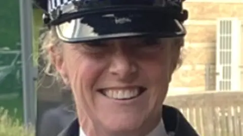 North Yorkshire Police PC Prior, a blonde woman, smiles at the camera in uniform