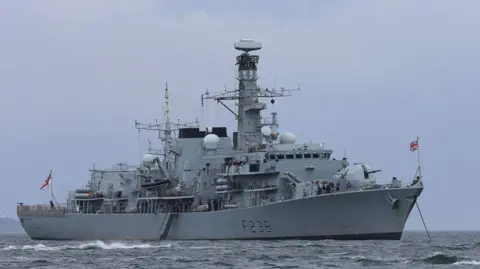 HMS Northumberland, a large grey navy ship, at sea, location unconfirmed, 2015. 