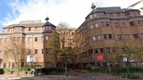 Cardiff Sixth Form College is a red brick building with trees outside