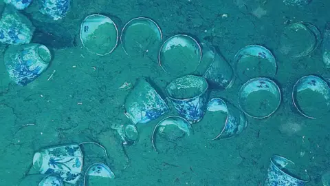 Reuters Porcelain cups, part of the San Jose shipwreck, are seen on the seabed in the Carribean Sea.