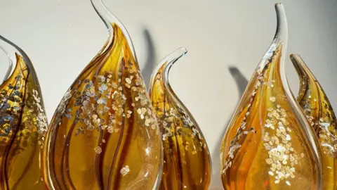 Worcester Cathedral Orange glass flames with gold glitter inside 