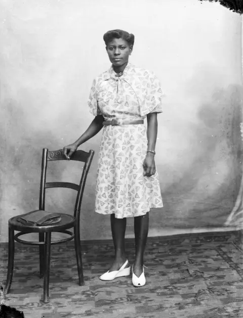 Deo Gratias Young woman in photographer's studio