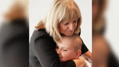 Mark Corns Maria Hanson MBE with Taylor 