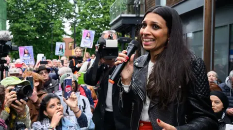 Getty Images Faiza Shaheen speaks to supporters during a rally held on her behalf after being excluded from the Labour Party's list of candidates