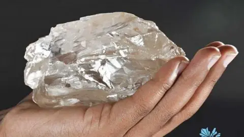 Lucara Diamond A hand holding a diamond