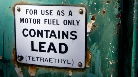 Alamy Old petrol pump sign saying "For use as a motor fuel only. Contains Lead (Tetraethyl)