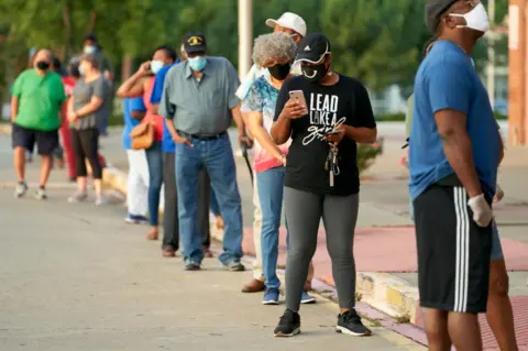 Getty Images Voters waiting to cast ballots