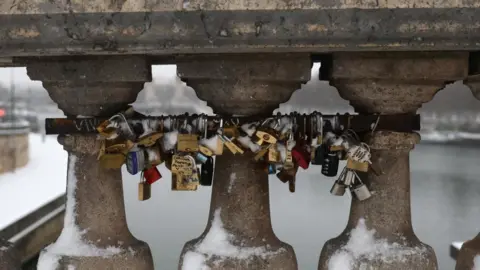 Reuters Padlocks on the snow-covered Pont de la Concorde Bridge in Paris