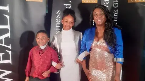 Janelle Clarke Ms Clarke and her children