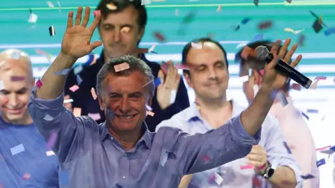 EPA Argentine President Mauricio Macri greets supporters at the Cambiemos headquarters, in Buenos Aires