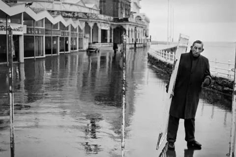 Michael Bennett Man walking near the sea