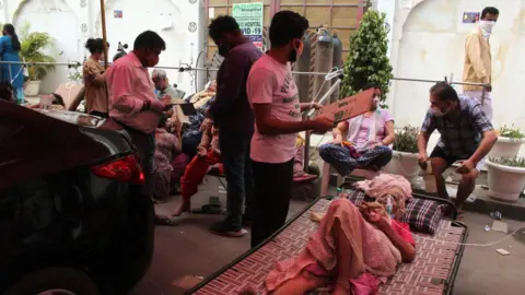 Getty Images A woman receives free oxygen support outside a Gurudwara (Sikh temple) in Ghaziabad, India