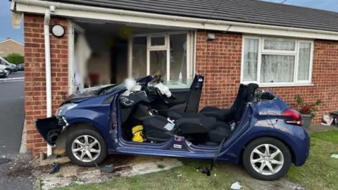 Cambs Police Car crashed into bungalow