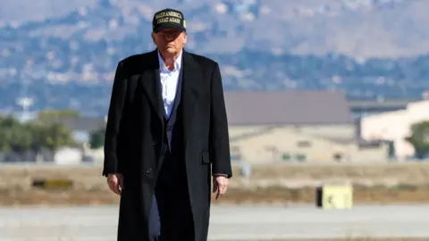 Reuters Republican presidential nominee and former US President Donald Trump walks as he arrives at the Albuquerque International Sunport, in Albuquerque, New Mexico.