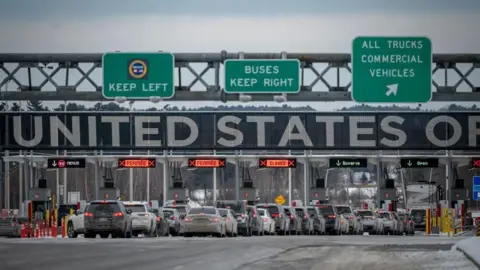 Cars cross the Canadian border