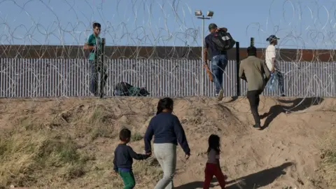 Getty Images Migrants near El Paso in May 2023