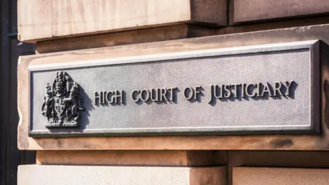 A metal sign at the High Court in Edinburgh.