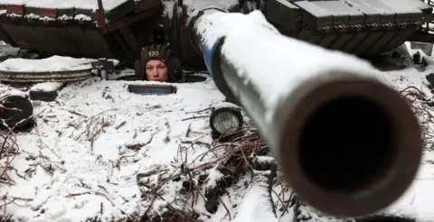 Getty Images A Ukrainian soldier looks out from a tank near to the town of Bakhmut, Donetsk region