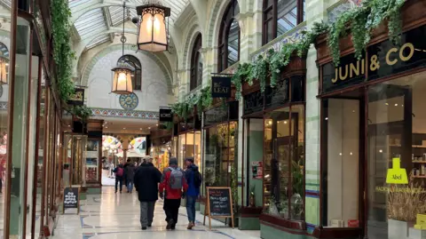 Owen Sennitt/BBC Royal Arcade in Norwich. Either side of the arcade is lined with businesses including food and drink, boutiques and homeware shops.