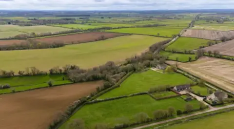 PA Media An aerial image of fields, lands and countryside in a rural setting in Wiltshire
