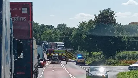 Mark Randall Traffic in a queue near the site of the incident with emergency services on the road