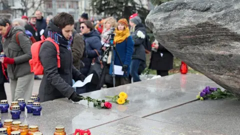 Getty Images OCTOBER 29, 2019: Young people attend an annual meeting at Solovetsky Stone memorial in Lubyanka Square in central Moscow on the eve of Remembrance Day of Political Repression Victims; during the event known as "Vozvrashcheniye Imyon" (Bringing Back the Names), the participants read out the names of victims of political repression and persecution in the Soviet Union.