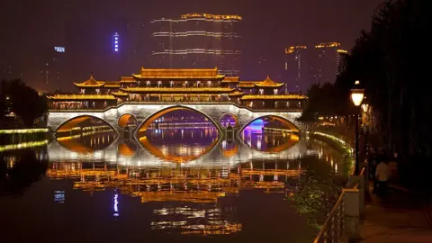 Getty Images Illuminated Anshun Bridge over the Jin River at night in the provincial capital of Chengdu in Sichuan