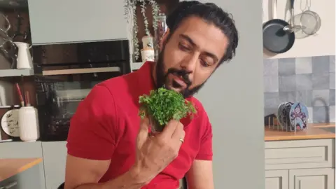 Ranveer Brar Chef Ranveer Brar with a bunch of coriander