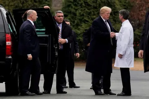 Reuters Donald Trump shakes hands with Dr Ronny Jackson after his annual physical exam at Walter Reed National Military Medical Center in Bethesda, Maryland, 12 January 2018