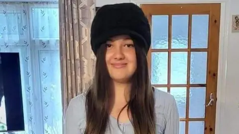 Family photo Teenager Phoebe Macias smiling