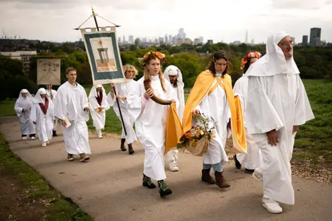 Aaron Chown / PA Media Members of the Druid Order perform a ceremony to celebrate the autumn equinox on Primrose Hill in London on 23 September 2022