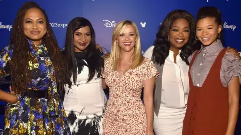 Getty Images (L-R) Director Ava DuVernay and actors Mindy Kaling, Reese Witherspoon, Oprah Winfrey and Storm Reid.