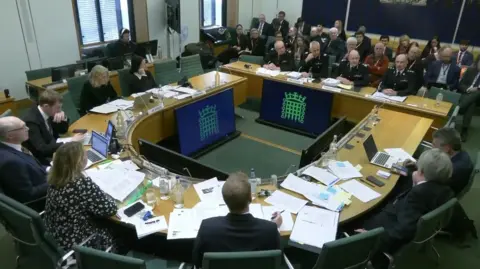 PA Media Screen grab of (left to right) Chief
Constable Mark Roberts, National Lead for Football Policing, UK Football Policing Unit, Mike O'Hara, Assistant Chief Constable, West Midlands Police, Craig Guildford, Chief Constable, West Midlands Police and Mick Wilkinson, Chief Inspector, West Midlands Police appearing before the Home Affairs Committee, for a hearing on Football Policing, at the House of Commons,