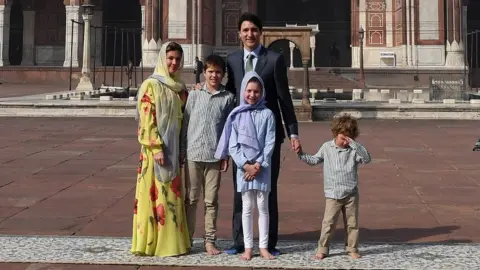Getty Images The Trudeau family in front of the Jama Masjid in New Delhi, with Hadrien dabbing