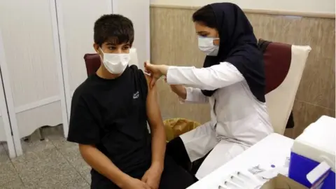 EPA Iranian student gets vaccinated against coronavirus (07/10/21)