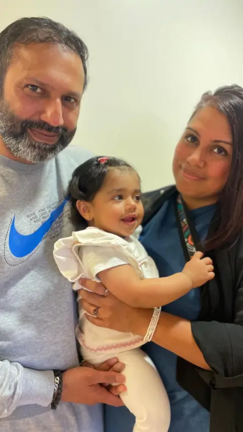 A picture of Maryan Chaudhry, her husband Arfan Ali and their one-year-old baby Liya
