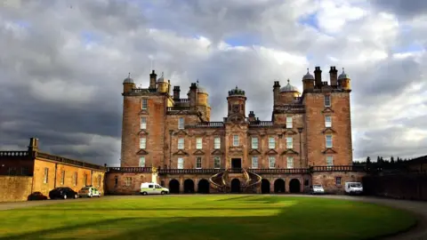 PA Media Police vehicles parked outside Drumlanrig Castle in Dumfries and Galloway where the painting The Madonna with The Yarnwinder by Leonardo da Vinci was stolen earlier today.