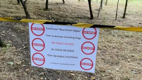 Environment Agency Warning signs near Dumbles Pond