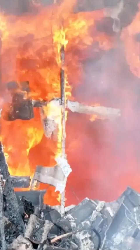 Close up exterior building fire with lots of flames