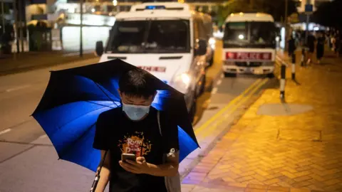 EPA activist near police vans