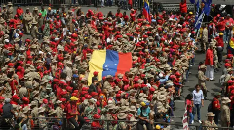 Government supporters attend a concert at which President Maduro is due to appear