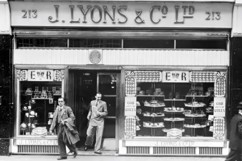 Getty Images The exterior of a Lyons tea shop along Piccadilly, London, 2nd July 1953. The shop window has been decorated to commemorate the coronation of Queen Elizabeth II