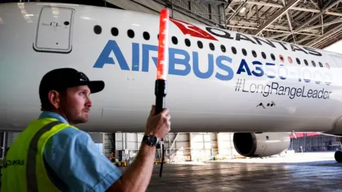 Getty Images Ground staff at Sydney airport