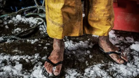 Rory Carnegie A man in flip flops in the cold - photo from NCA's 'Invisible People' exhibition