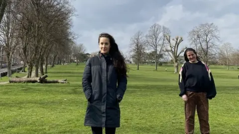 BBC Maya and Lou standing on park