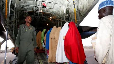 Reuters Some of the newly-released Dapchi schoolgirls board a plane in Maiduguri, Nigeria March 21, 2018.