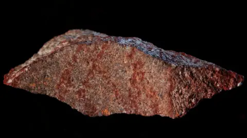 Reuters The oldest-known drawing, painted in ochre pigment on a small stone