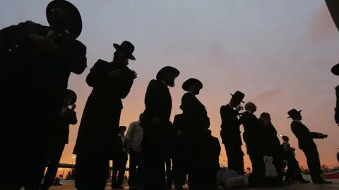 Getty Images Orthodox Jews gather to celebrate the completion of study of the entire Talmud religious text in East Rutherford, New Jersey