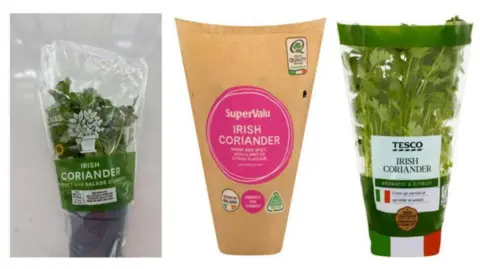 Food Safety Authority of Ireland Three pots of coriander are wrapped in clear plastic and one in a brown wrapper.