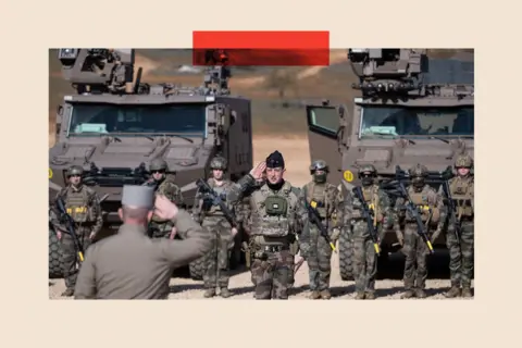 AFP via Getty Images French soldiers salute the general Alain Lardet (bottom L)
